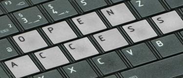 Open Access-Schriftzug hervorgehoben auf einer Tastatur